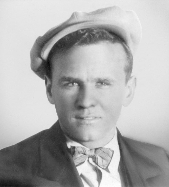 young william branham with bowtie and driving cap on.